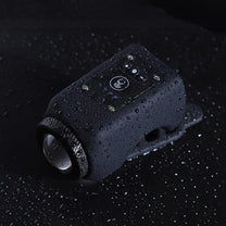 2-in-1 electric horn and headlight in black with water splashes