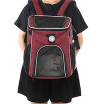 Foldable 2-in-1 pet bike bag and backpack in red, worn by a person, front view