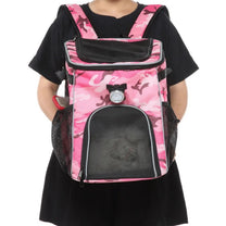 Foldable 2-in-1 pet bike bag and backpack in pink, worn by a person, front view