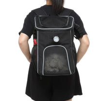 Foldable 2-in-1 pet bike bag and backpack in black, worn by a person