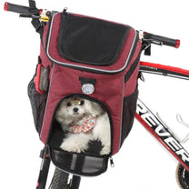 Foldable 2-in-1 pet bike bag and backpack in red with a dog inside, angled view