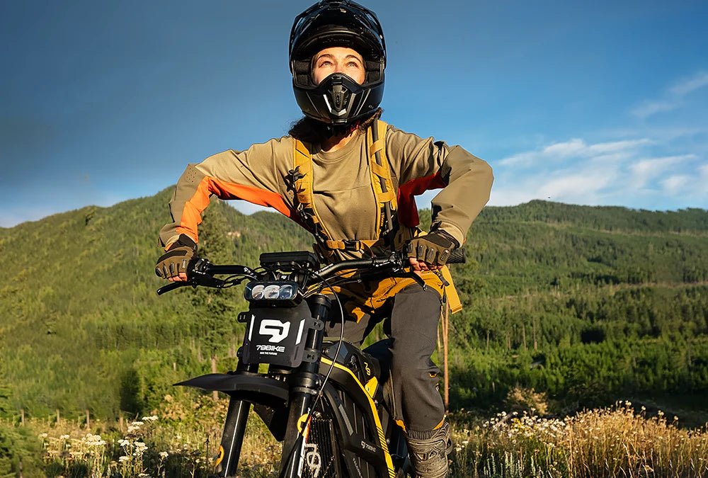 Person standing with the 79BIKE Falcon Pro electric dirt bike