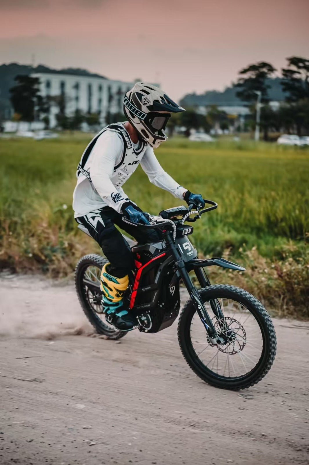 Person riding the 79BIKE Falcon Pro electric dirt bike in the forest