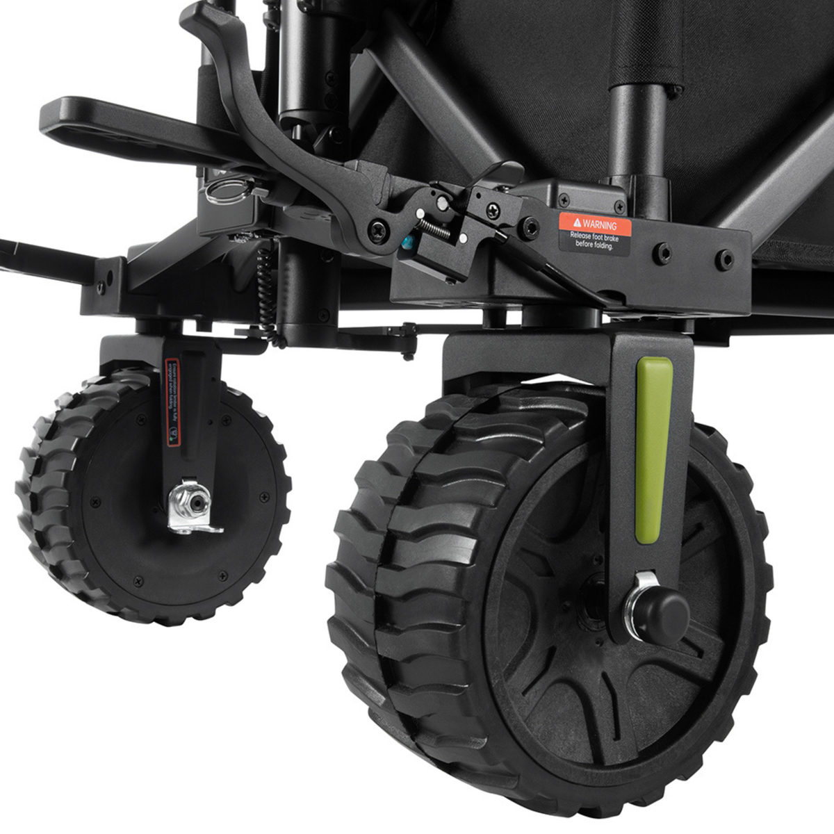 DYU CampX, close-up of two chunky-tread wheels, lever and warning label on the black chassis