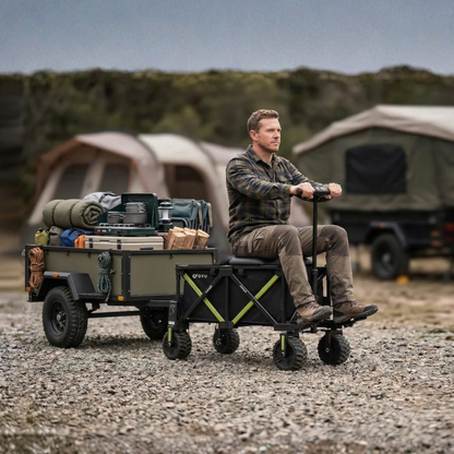 DYU CampX on gravel with a man sitting on the wagon next to a loaded trailer and a tent