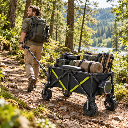 Man pulling the DYU CampX wagon along a forest path, loaded with outdoor gear
