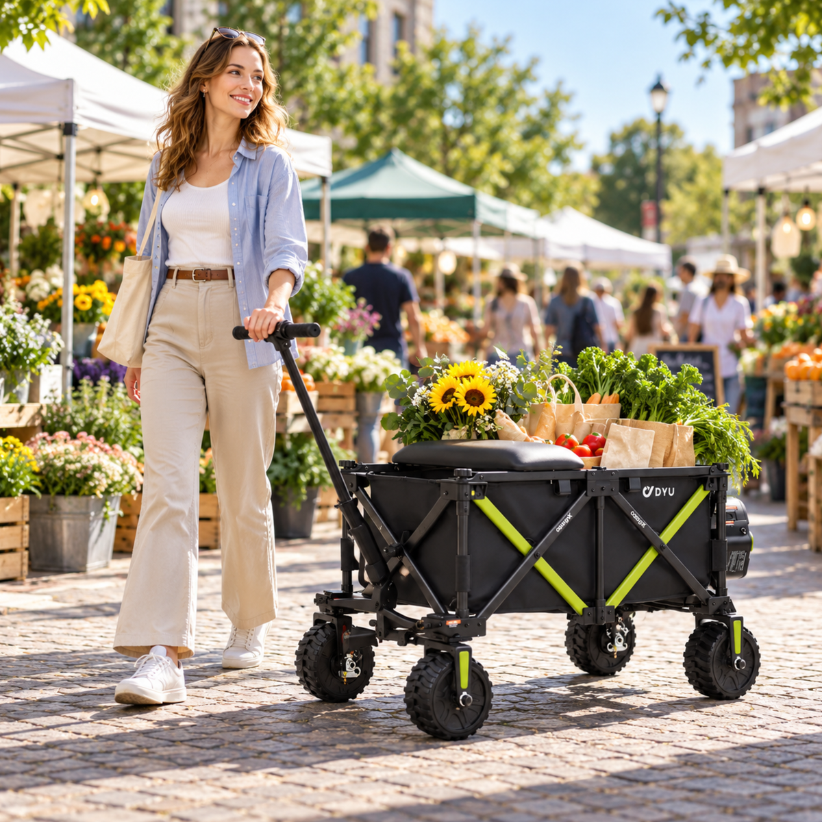 Woman pulling the DYU CampX wagon at a market, with flowers and shopping bags on the wagon