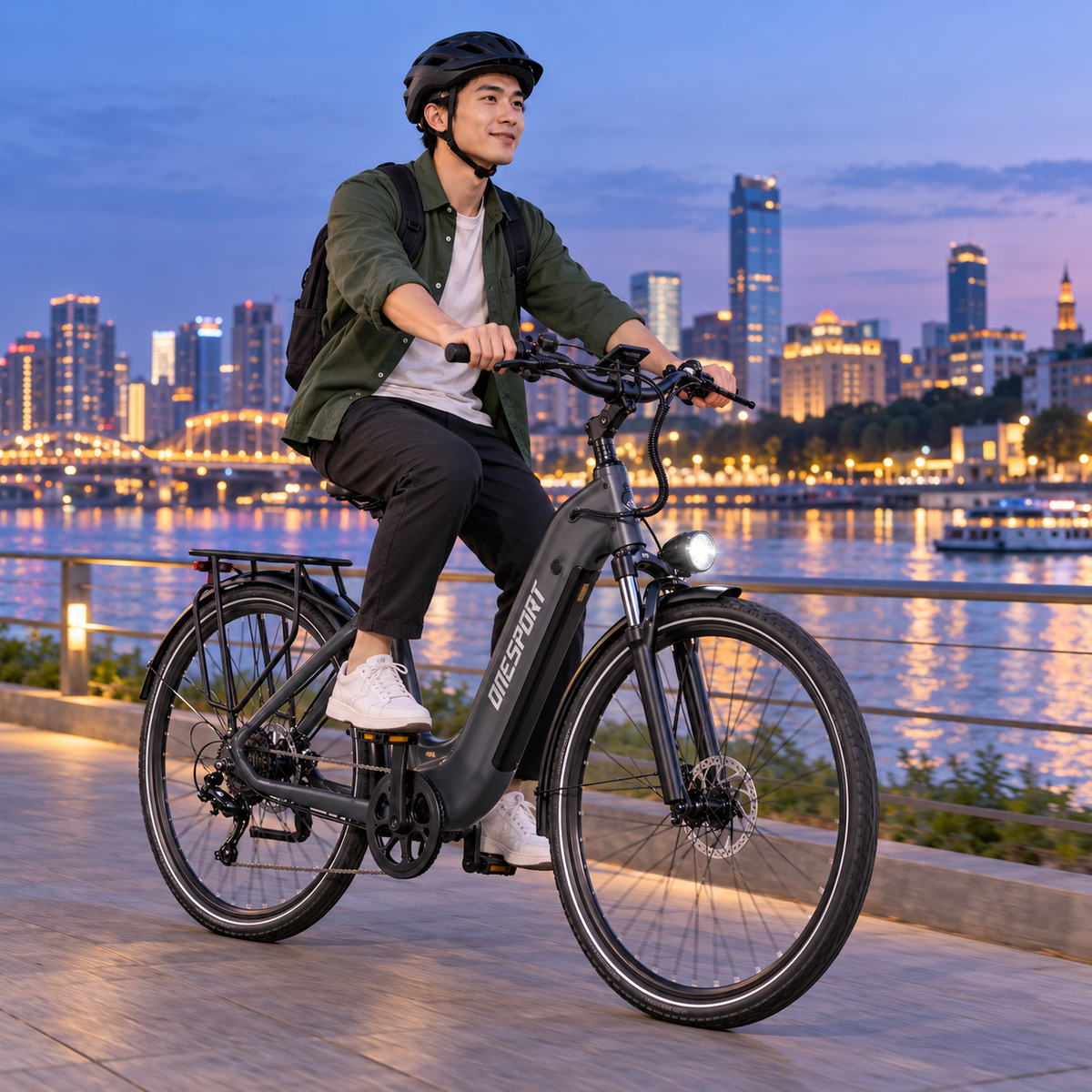 Man riding a grey OneSport OT05 Max by a river at dusk with a city skyline in the background