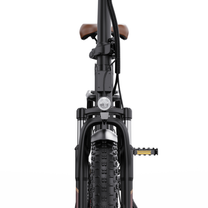 OneSport OT16 Pro seen from the front with headlight, suspension fork, chunky-tread front tyre and brown saddle