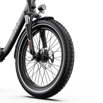 OneSport OT16 Pro front wheel with chunky-tread tyre, spokes, disc brake and suspension fork