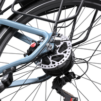 Close-up of rear wheel hub with brake disc and caliper on the OneSport WT05