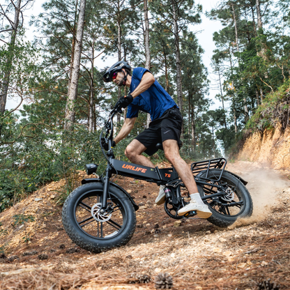 URLIFE T5 side view, rider descending a gravel forest trail