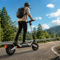 Person wearing a helmet and backpack riding Wheely - J18 on a winding road through a forest on a sunny day
