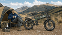 Person sitting next to the APEFOX RH20 folding fat-tyre e-bike on a grassy field