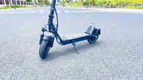 DriveTron DT01 electric scooter, rear three-quarter view in the city