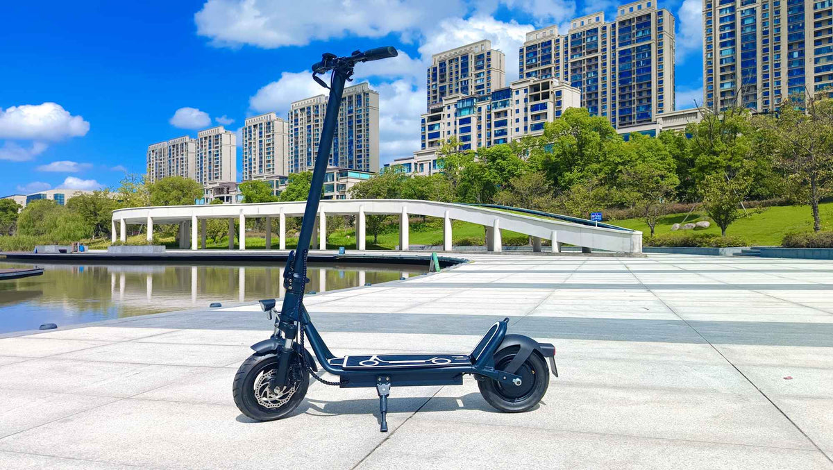 DriveTron DT01 electric scooter seen from the side by a lake