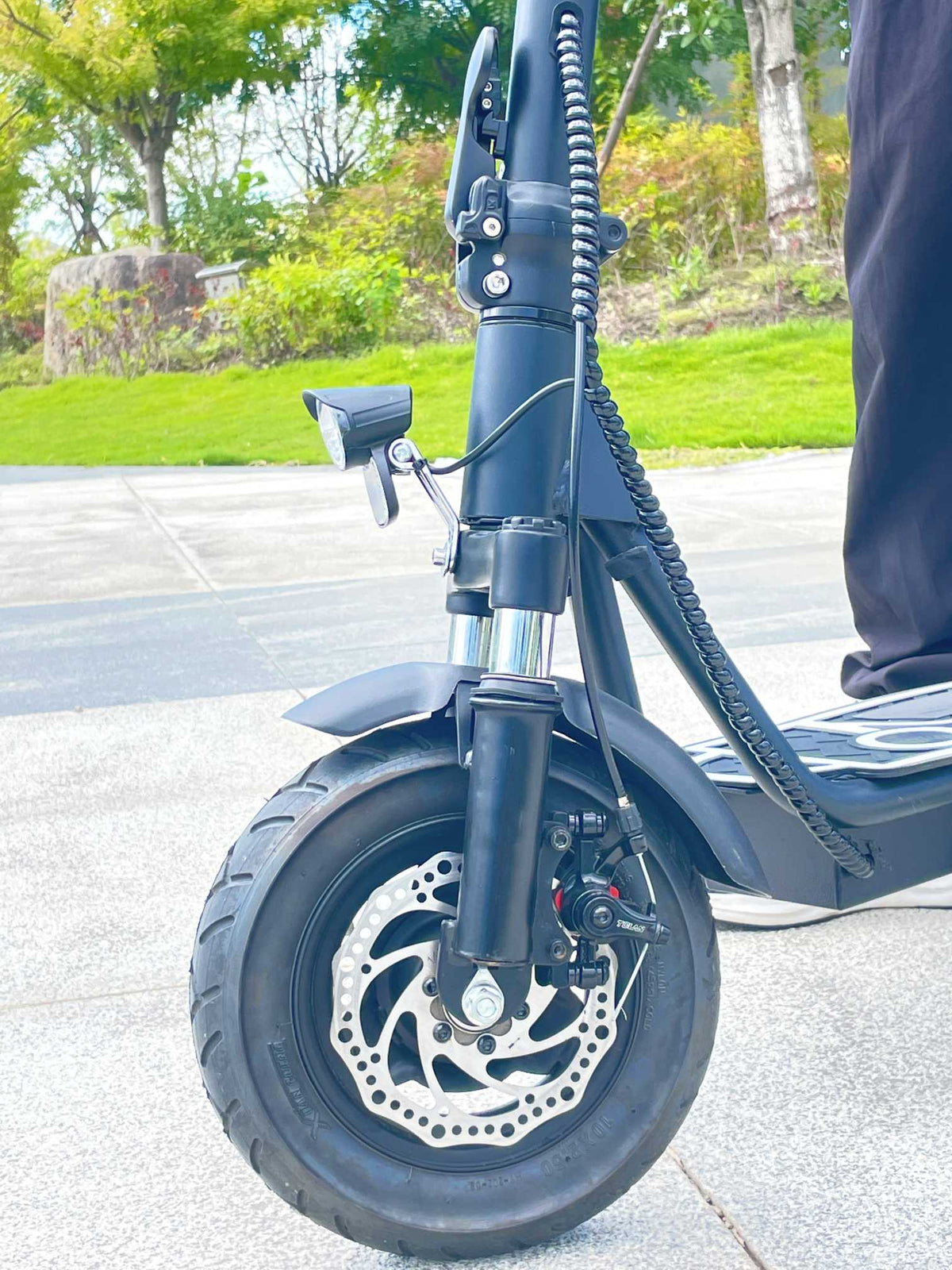 DriveTron DT01 front wheel and fork on a street