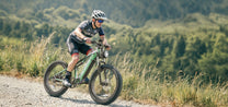 Man riding the Duotts E26 fat-tyre e-bike on a footpath