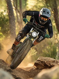 Rider taking the Duotts E26 fat-tyre e-bike off-road