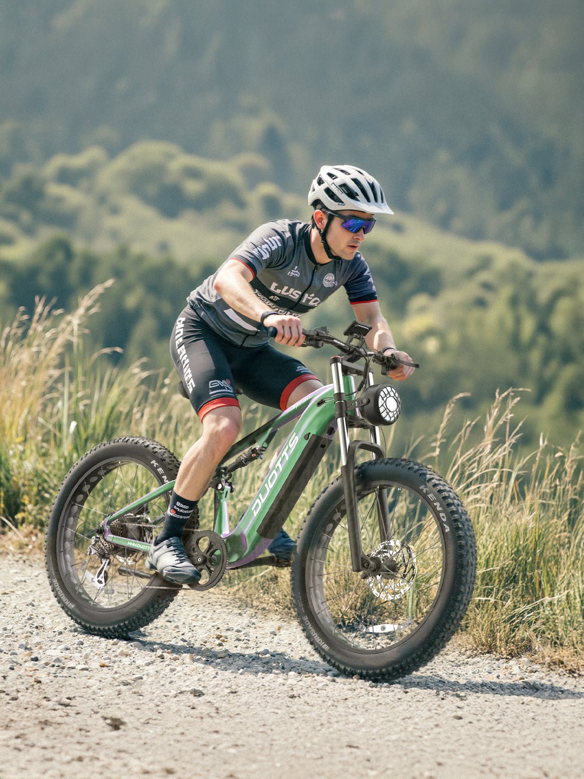 Man riding the Duotts E26 fat-tyre e-bike on a footpath