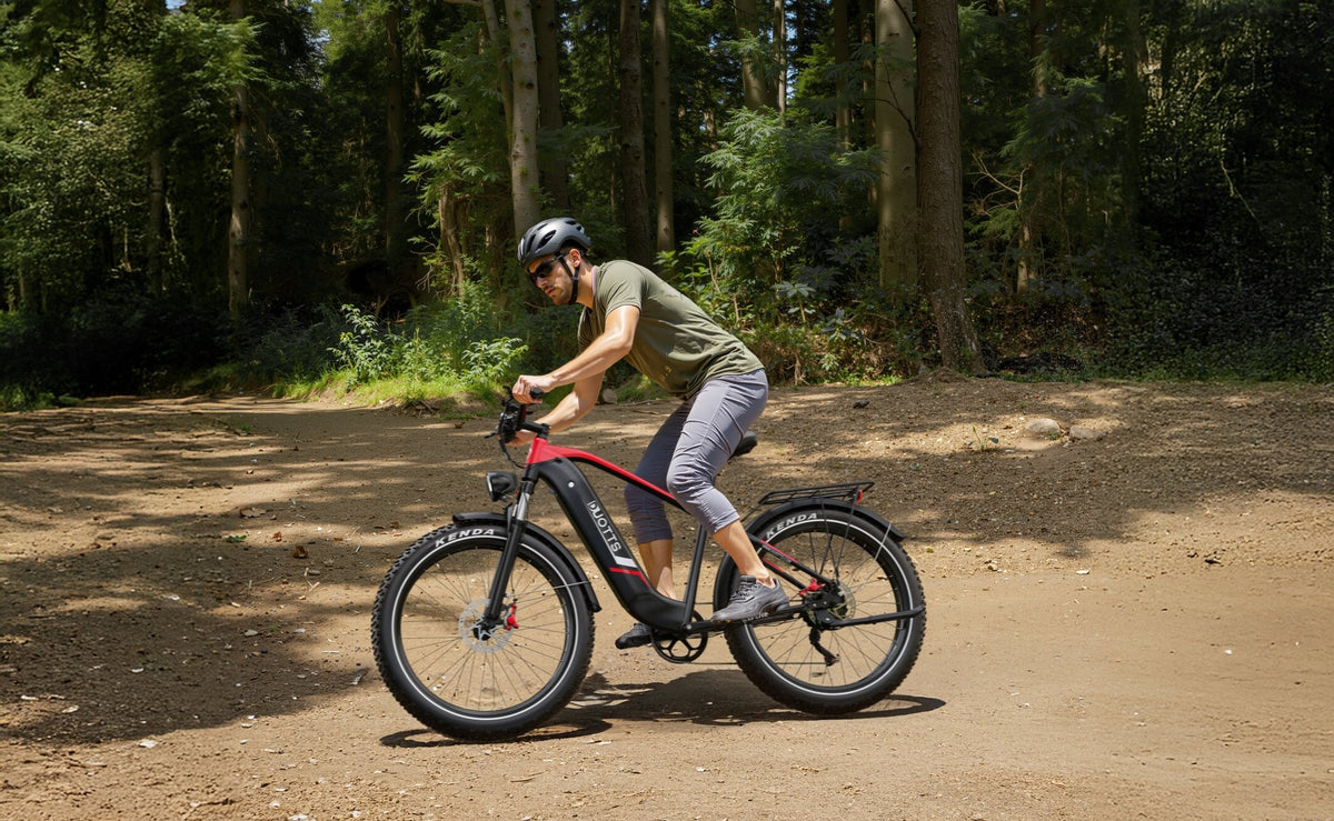 Man riding the Duotts F26 Lite fat-tyre e-bike on a footpath
