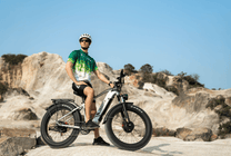 Rider taking the Duotts F26 fat-tyre e-bike off-road