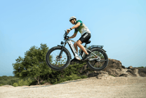 Rider taking the Duotts F26 fat-tyre e-bike off-road