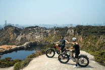 Two riders with the Duotts F26 fat-tyre e-bike