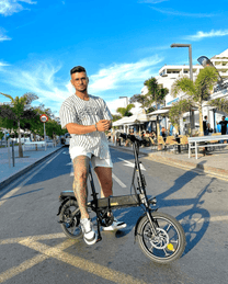Man standing with the DYU A1F Pro folding e-bike in the city