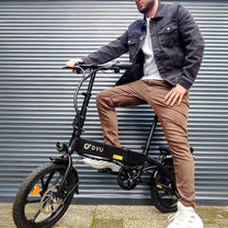 Man standing with the DYU A1F Pro folding e-bike