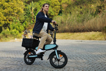 Man riding the DYU C2 folding e-bike on a footpath