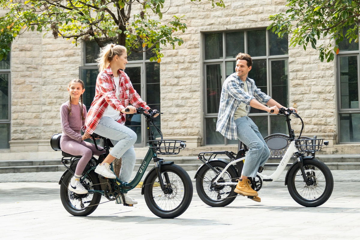 Two riders with the DYU C9 folding e-bike in the city