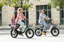 Two riders with the DYU C9 folding e-bike in the city