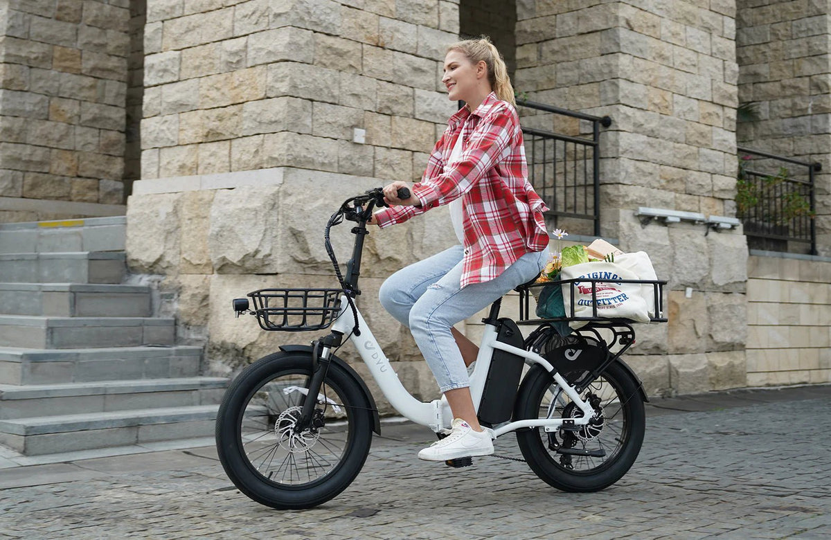 Woman riding the DYU C9 folding e-bike in the city