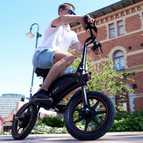 Man riding the DYU D3S folding e-bike in the city