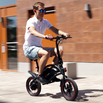 Man riding the DYU D3S folding e-bike in the city