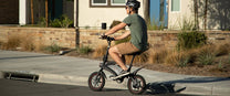 Man riding the DYU D3S folding e-bike on a footpath