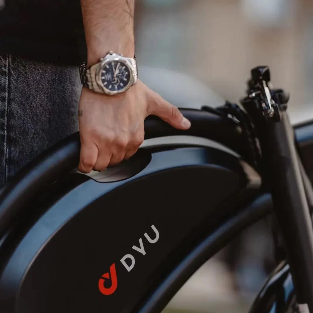Person carrying the folded DYU D3S folding e-bike