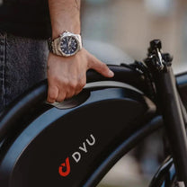 Person carrying the folded DYU D3S folding e-bike
