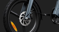 DYU T1 front wheel and fork against a dark background