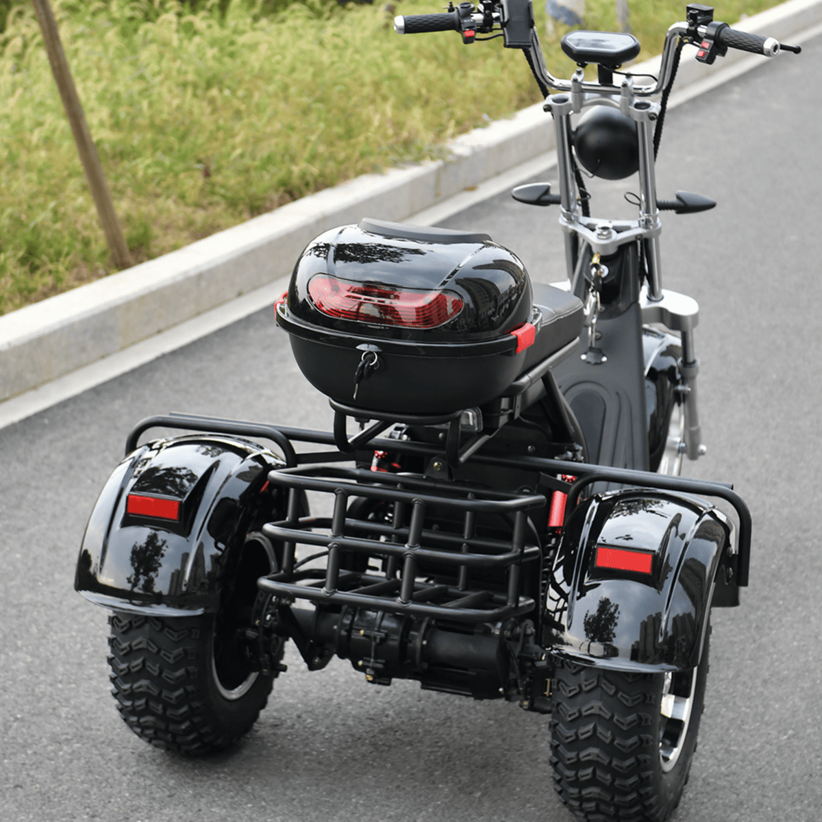 eHoodax 05WQ electric tricycle, rear three-quarter view on a road
