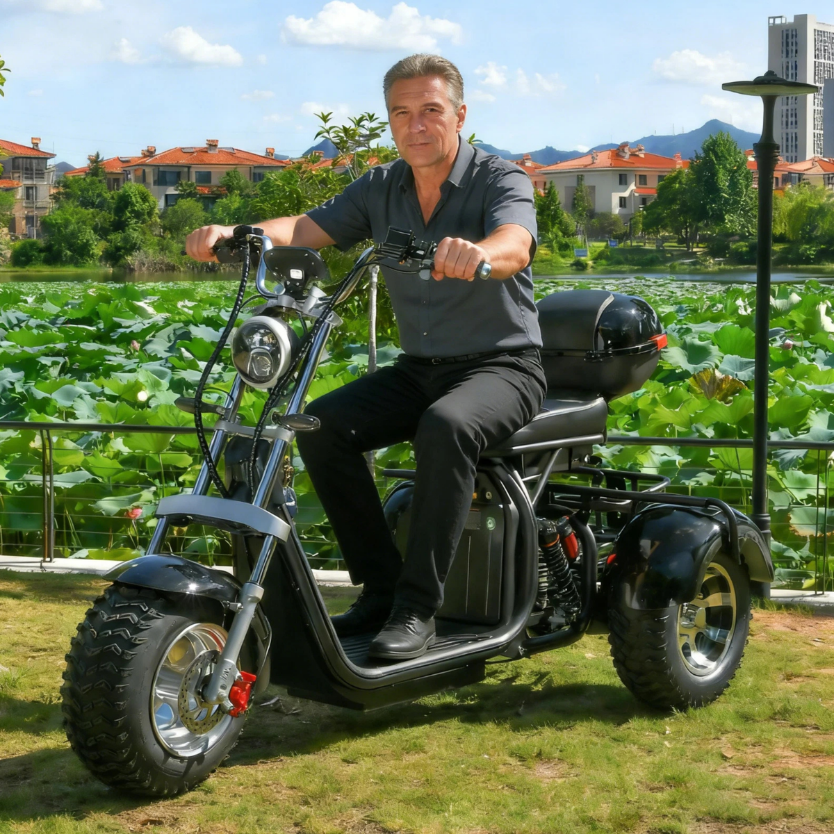 Man sitting on the eHoodax 05WQ electric tricycle in a park