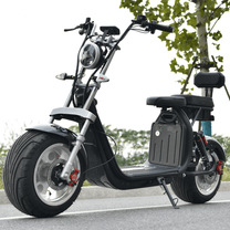 eHoodax X10 City Road electric scooter seen from the side on a road