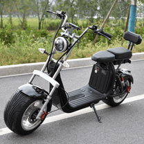 eHoodax X10 City Road electric scooter, front three-quarter view on a road