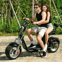 Two riders with the eHoodax X10 City Road electric scooter