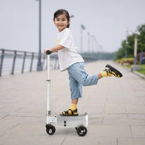 Child standing on the AeroDrive Edition electric ride-on suitcase outdoors