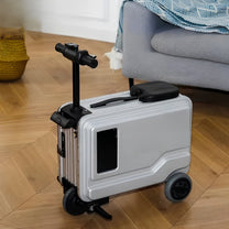PowerDrive Pro Edition electric ride-on suitcase in silver at home