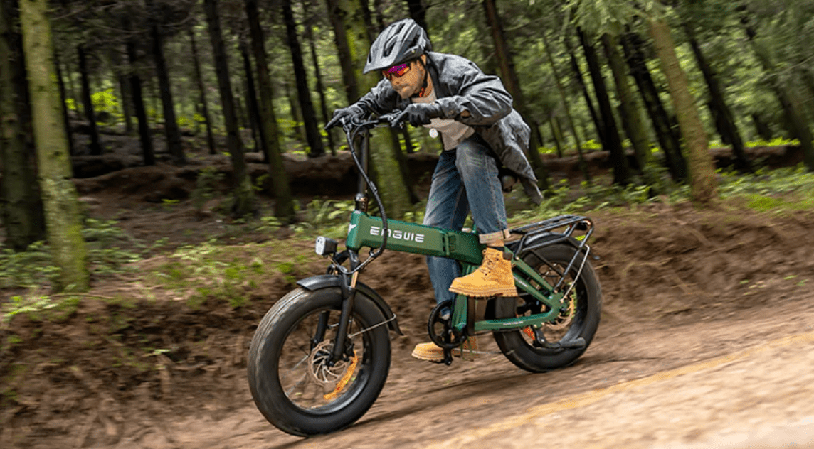 Rider taking the ENGWE EP-2 3.0 Boost folding fat-tyre e-bike off-road in the forest