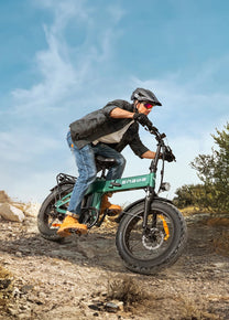 Rider taking the ENGWE EP-2 3.0 Boost folding fat-tyre e-bike off-road
