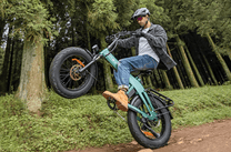 Rider jumping with the ENGWE EP-2 3.0 Boost folding fat-tyre e-bike